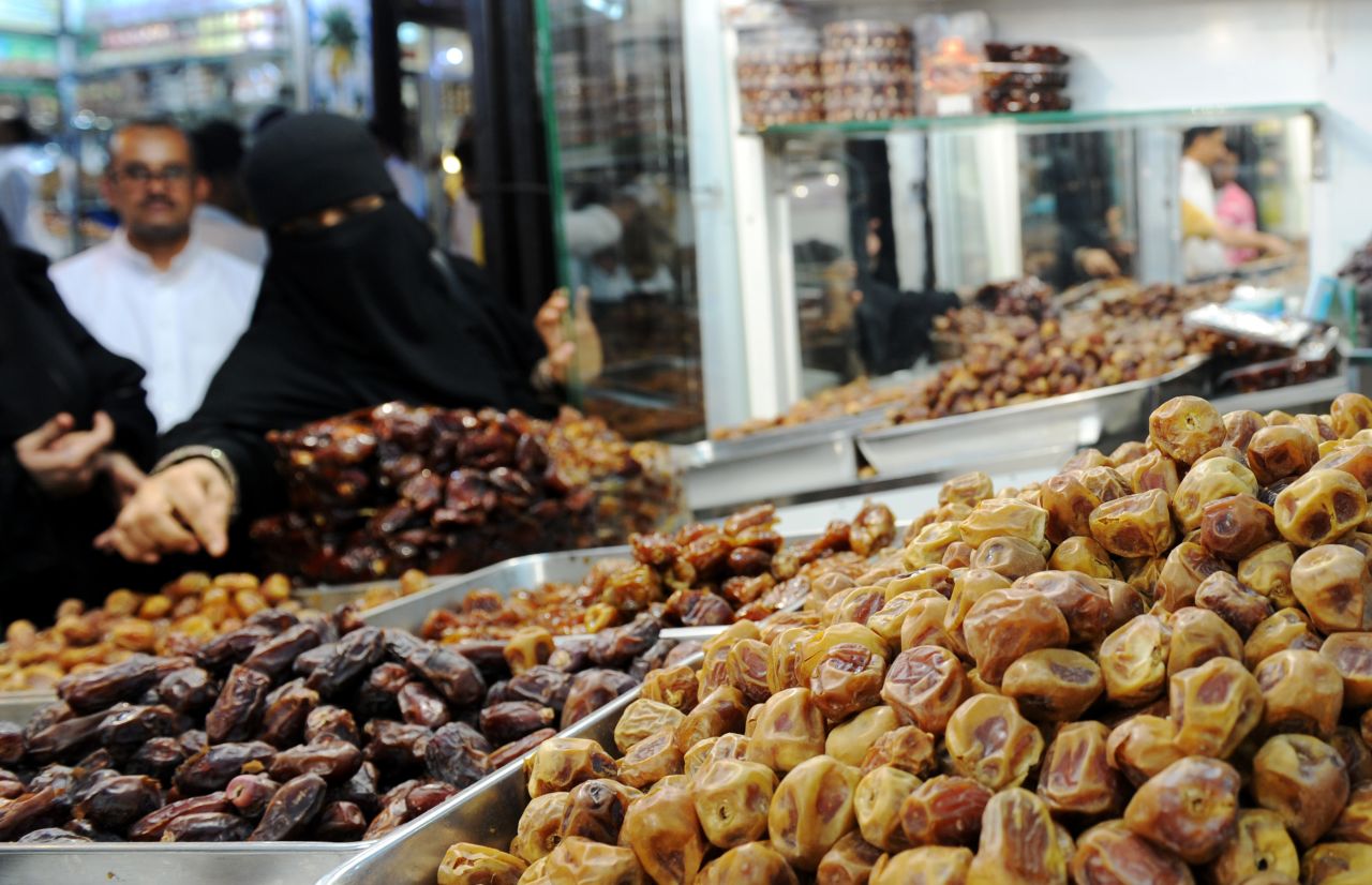 A woman shops for dates at a market in Jeddah, Saudi Arabia, on Friday, June 3.