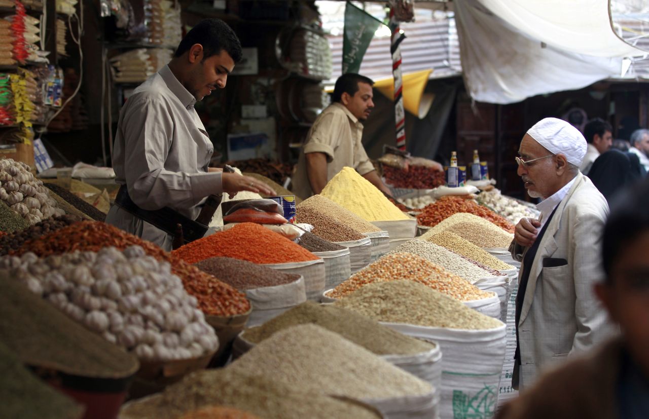 People shop for food at a market in Sanaa, Yemen, on June 5.