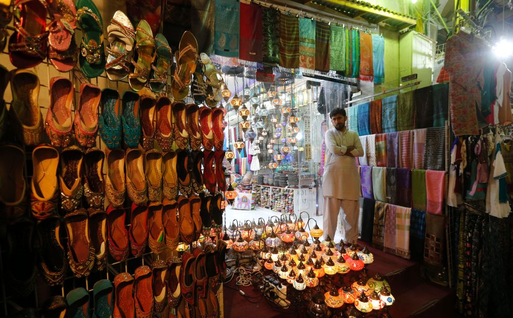 A vendor stands outside a shop in Dubai, United Arab Emirates, on June 5.