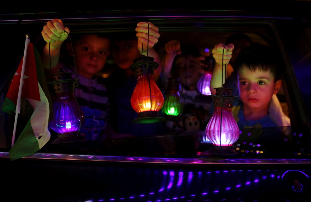 Children in Amman, Jordan, hold traditional lanterns at the start of Ramadan on Sunday, June 5. 