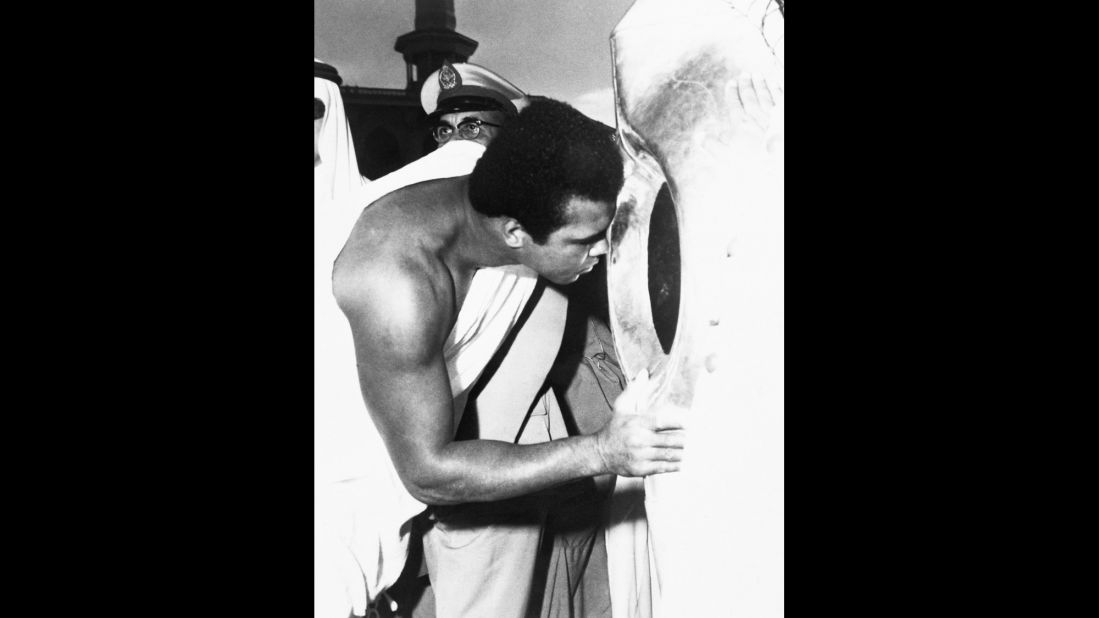Muhammad Ali kisses the Holy Black Stone in the Kaaba during his pilgrimage to Mecca in January 1972. The stone is said to have been given to Abraham by the archangel Gabriel.