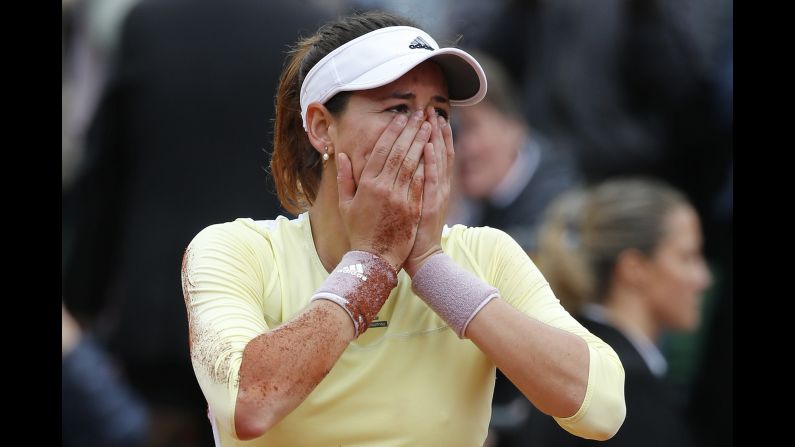 Garbine Muguruza reacts after winning the French Open on Saturday, June 4. The Spaniard <a href="index.php?page=&url=http%3A%2F%2Fwww.cnn.com%2F2016%2F06%2F04%2Ftennis%2Ffrench-open-serena-williams-muguruza-tennis%2Findex.html" target="_blank">defeated Serena Williams</a> for her first-ever Grand Slam title.