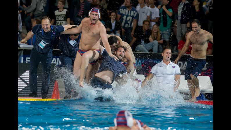 Members of VK Jug, a water polo team from Dubrovnik, Croatia, celebrate after winning the Champions League title in Budapest, Hungary, on Saturday, June 4.