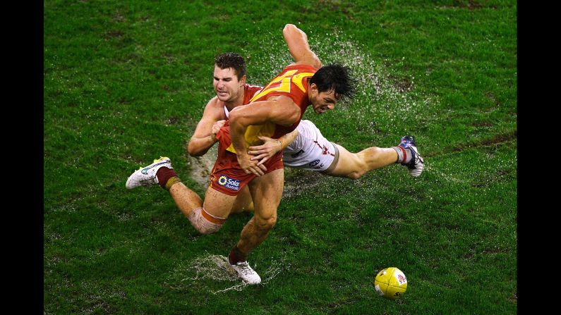 Harrison Marsh of the Sydney Swans tackles Jesse Lonergan of the Gold Coast Suns during an Australian Football League match on Saturday, June 4.