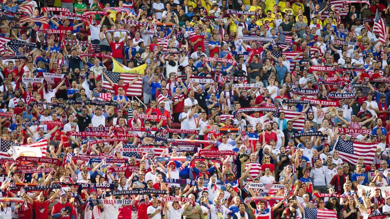 Fans of the U.S. men's soccer team hold scarves and flags before the opening game of the Copa America tournament on Friday, June 3. The Americans lost 2-0 to Colombia in Santa Clara, California.
