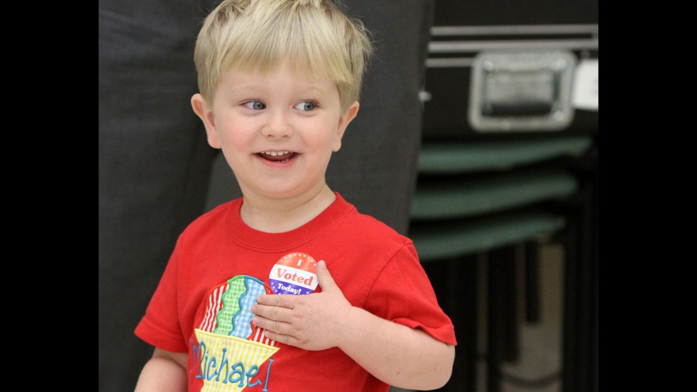 Michael Held III, a 2-year-old from Biloxi, Mississippi, sports an "I Voted" sticker after he went to a voting location with his father on Tuesday, March 8. Many children across the country have accompanied their parents to the polls this year.
