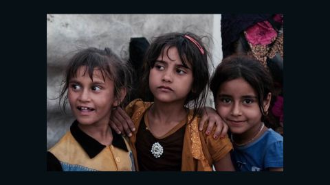 Girls play at the refugee camp in Abu Ghraib, Iraq.