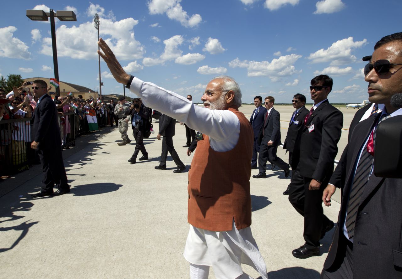 Modi waves after arriving at Andrews Air Force Base in Maryland.