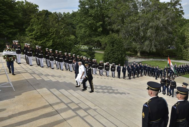 Modi, in white, arrives for a wreath-laying ceremony Monday, June 6, at Arlington National Cemetery in Arlington, Virginia.