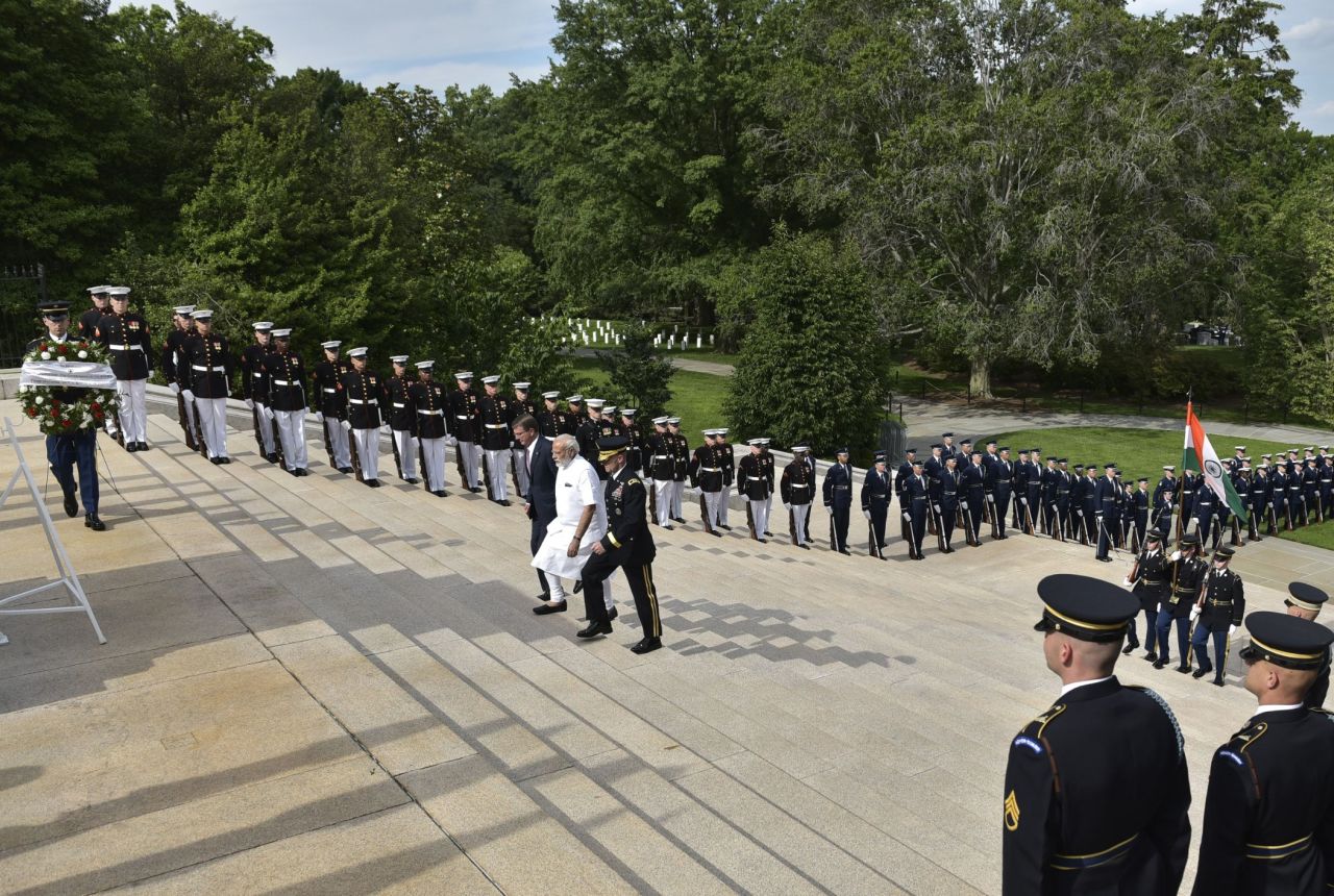 Modi, in white, arrives for a wreath-laying ceremony Monday, June 6, at Arlington National Cemetery in Arlington, Virginia. 