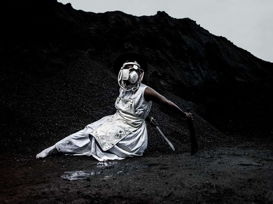 Named after a suburb in Cape Town, the piece sees a lone figure dressed in white standing against a stark asphalt landscape and brandishing large industrial tools as if they were weapons. "Endabeni is actually very key in understanding where the South African structure of a town comes from because it was the first segregated structure in the whole of South Africa", Modasikeng explains.