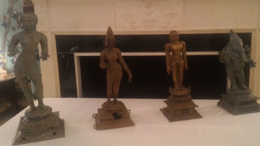 The ancient artifacts are lined up on display.  On the far right is a bronze of the widely worshiped Hindu deity Ganesha, with his elephant head and multiple upper limbs.  He is thought to  be over 1,000 years old.