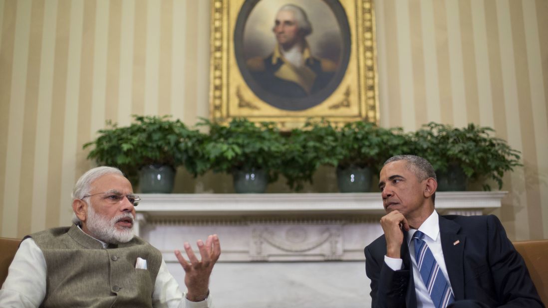 U.S. President Barack Obama listens to Modi during their meeting in the White House Oval Office on June 7.