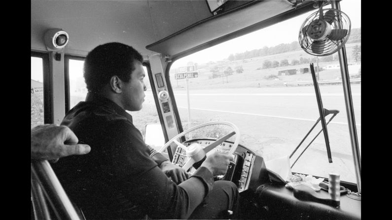 Ali drives around a busload of reporters in 1976, before his third fight with Ken Norton. "It was a publicity thing that Ali's driving the bus," Kalinsky said. "Well, he drove the bus into a ditch. And I know he purposefully did that because he told me he was going to do it."