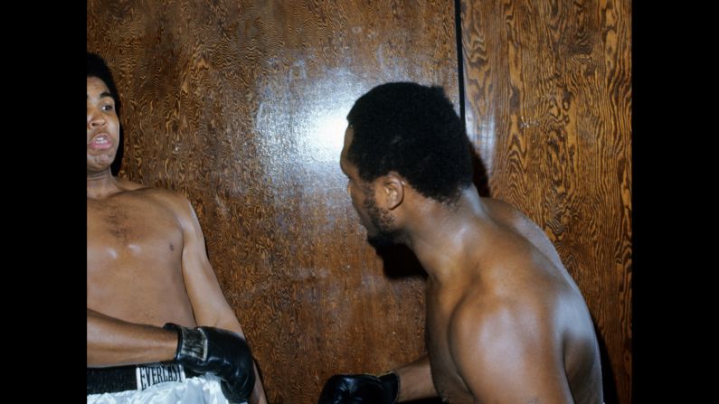 The two boxers fooled around for the camera at Kalinsky's request. "I said: 'Come on guys, you've got to make it look more realistic. Make it look like you're in the ring at the Garden, and I'll do what I have to do,' " Kalinsky recalled. "And they started jabbing a little bit, and Joe hits Ali in the stomach with a huge left and Ali goes down. ... Ali looked up at Joe and said, 'You son of a gun can really hit.' And Joe looks at Ali and he said: 'That's the way it's going to be the night of the fight.' " Frazier, of course, would go on to win the fight and hand Ali his first professional loss.