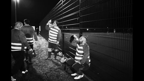 Players from Beer Bellies United hydrate during a match.