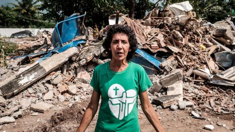 Maria da Penha amid the rubble of Rio de Janeiro's Vila Autodromo neighborhood near the city's Olympic Park.