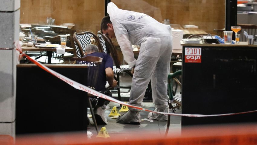 Israeli forensic police inspect a restaurant following a shooting attack at a shopping complex in the Mediterranean coastal city of Tel Aviv on June 8, 2016. 
Two Palestinians opened fire at a popular Tel Aviv nightspot near Israel's military headquarters on June 8, 2016, police said, killing four people and injuring five in one of the worst attacks in a months-long wave of violence.  / AFP / JACK GUEZ        (Photo credit should read JACK GUEZ/AFP/Getty Images)