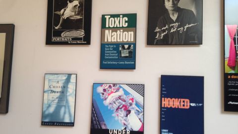 The wall of Lonny Shavelson's office, lined with covers of the books he has written.