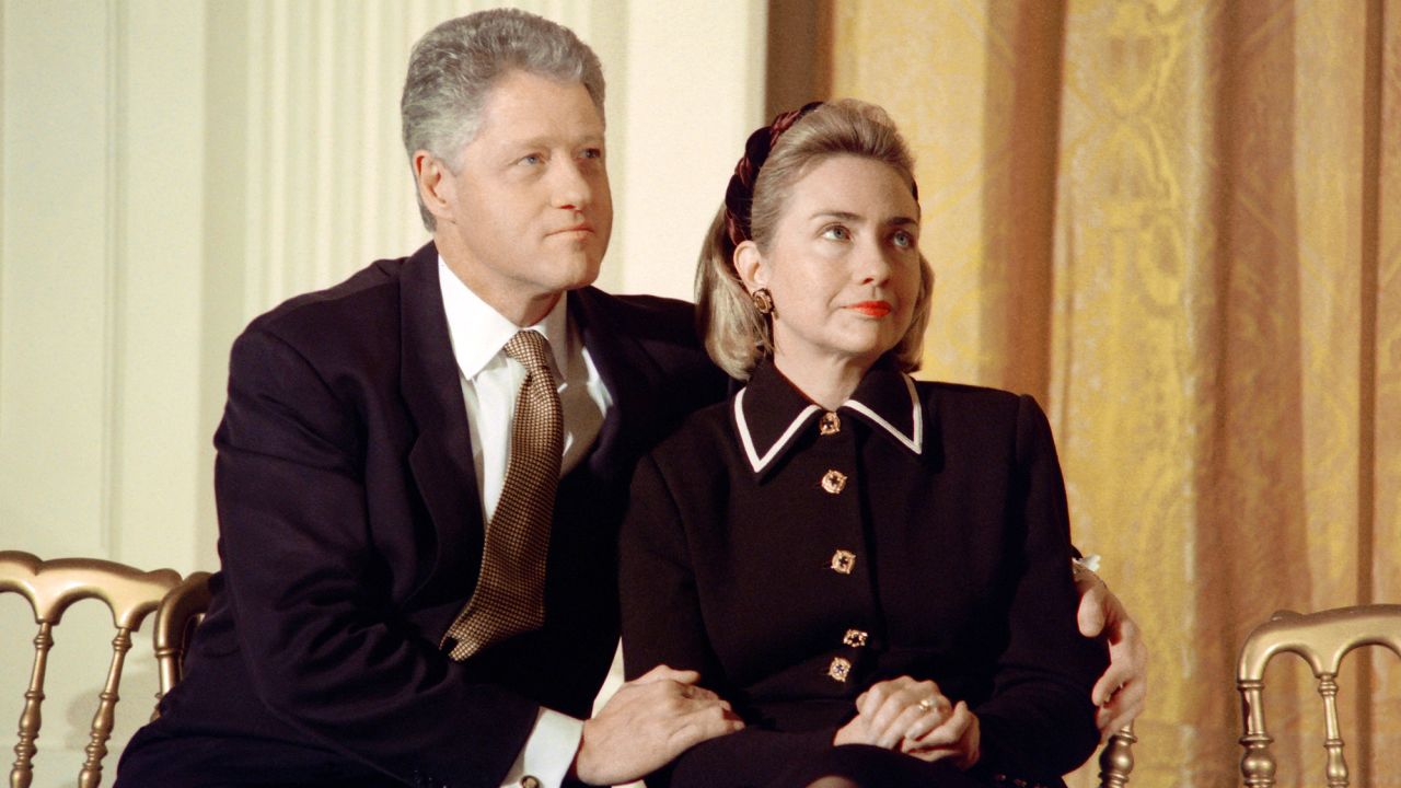 President Bill Clinton and his wife Hillary listen to speakers at a coalition for America's Children event at the White House in 1997.