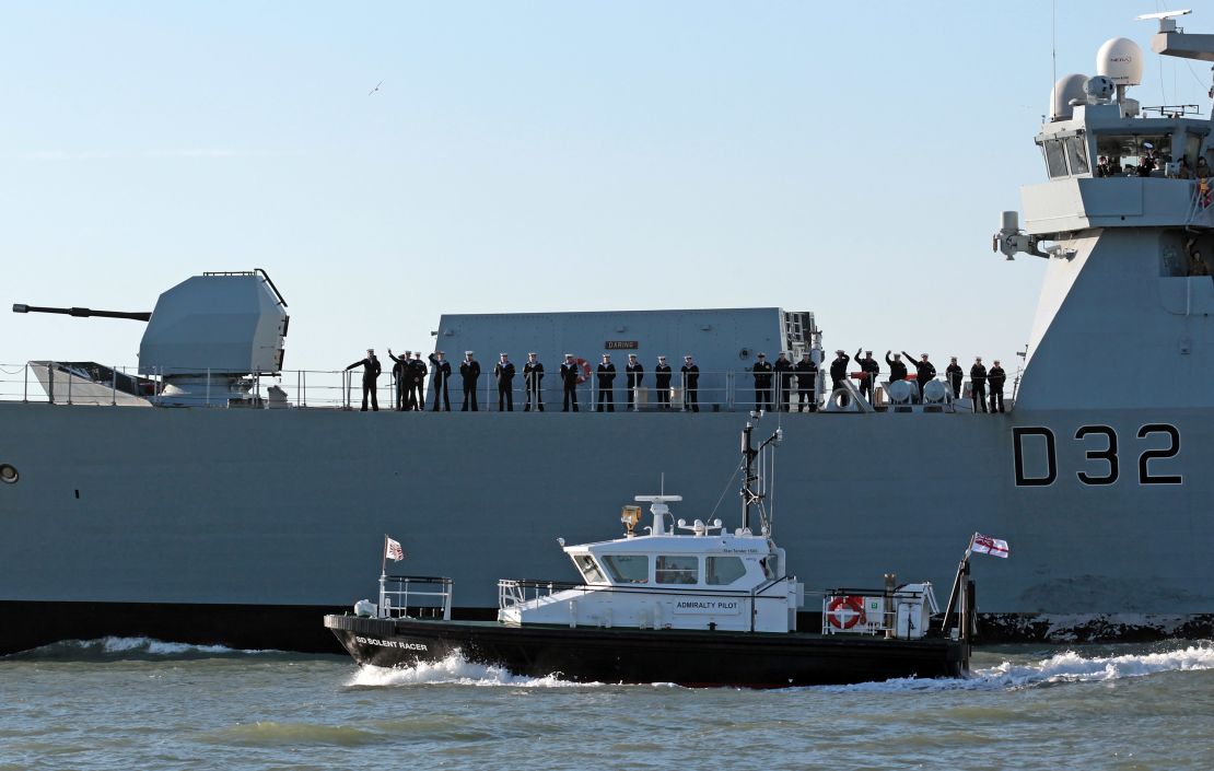 Crew aboard HMS Daring, the largest and most powerful destroyer warship ever built for the Royal Navy, leaves Portsmouth Harbour on January 11, 2012 in Portsmouth, England.