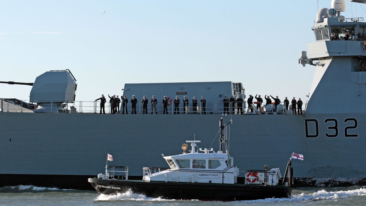 Crew aboard HMS Daring, the largest and most powerful destroyer warship ever built for the Royal Navy, leaves Portsmouth Harbour on January 11, 2012 in Portsmouth, England.