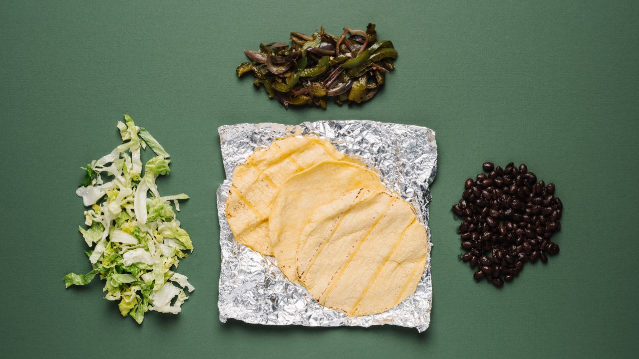 For vegans, tacos with black beans, fajita vegetables and romaine lettuce are a healthy option. Plus, you save on saturated fat by skipping the cheese.