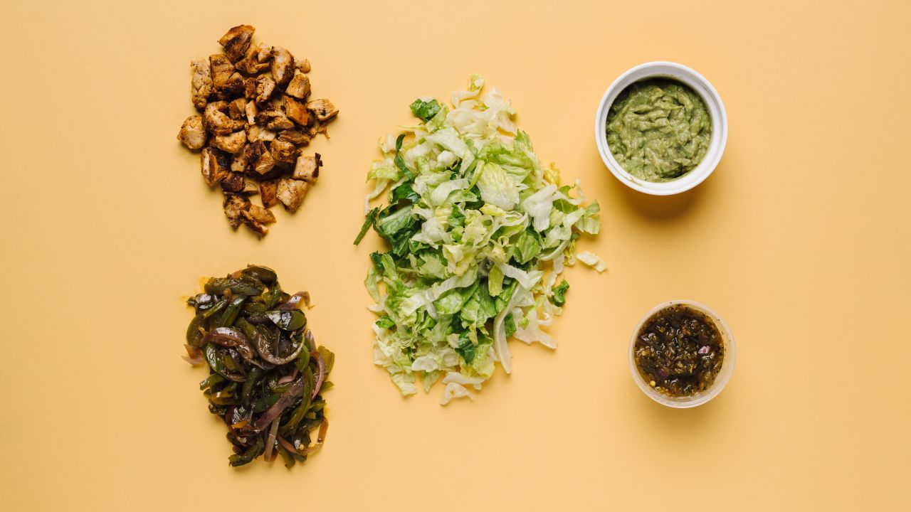Low carbs at Chipotle are maintained by skipping the tortilla in a burrito bowl with chicken, fajita vegetables, tomatillo green-chili salsa, guacamole and romaine lettuce.