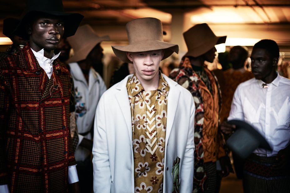 South African model Sanele Junior Xaba stands backstage before a show with the South African designer Chu Suwanapha, during South African Menswear Week at Cape Town Stadium, South Africa 2015.