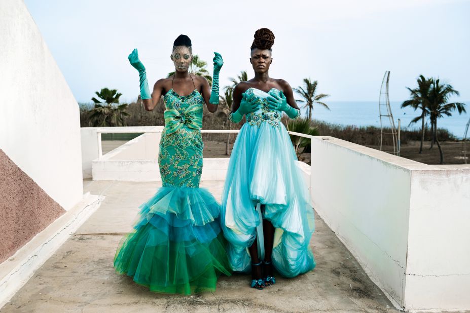 Models fit dresses for the Paris-based Cameroonian designer label Martial Tapolo Couture before a show in the Hotel des Almadies during Dakar Fashion Week, Senegal 2014.