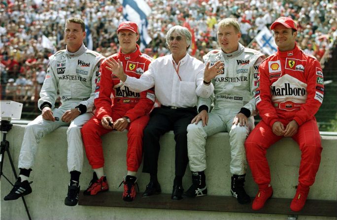 Ecclestone posing with (from L-R) David Coulthard, Michael Schumacher, Mika Hakkinen and Rubens Barrichello at the Hungarian Grand Prix in 2000. Today, the 85-year-old Briton shows no sign of slowing down. 