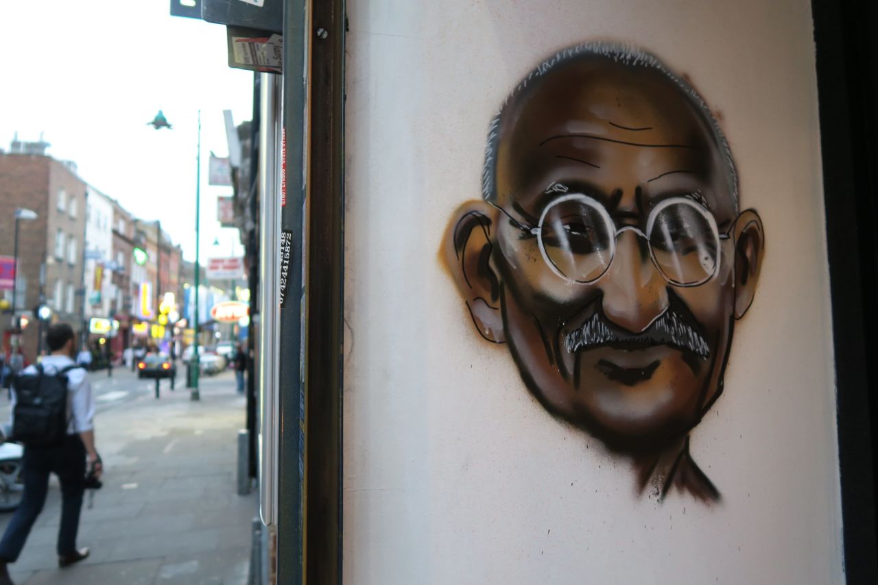 Indian hero Mahatma Gandhi is painted on the wall of a restaurant on Brick Lane.