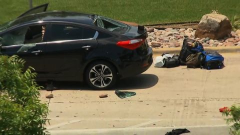 The incident began at this car outside baggage claim, where the man used large landscaping rocks to break the windows, Dallas police said.
