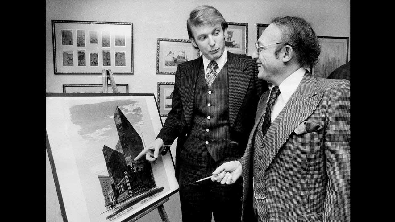 Donald Trump with Alfred Eisenpreis, the New York City Economic Development Administrator, look over a sketch of new 1,400 room Renovation project of Commodore Hotel in 1976.  