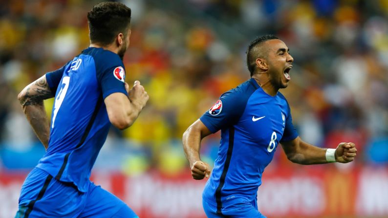 Dimitri Payet, right, celebrates his spectacular goal that gave France a 2-1 victory over Romania in the opening match of Euro 2016. The match was played in the Stade de France just north of Paris.