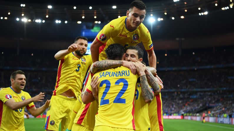 Romanian players celebrates Stancu's goal.