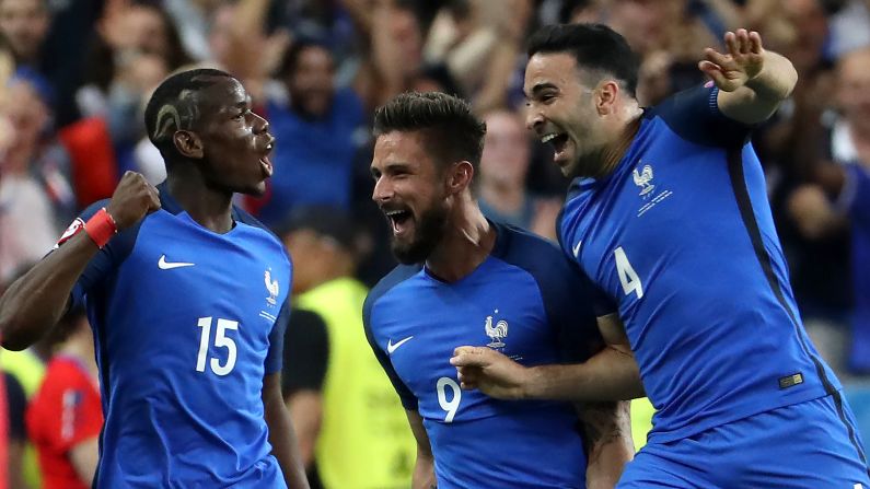 From left, French players Paul Pogba, Olivier Giroud and Adil Rami celebrate Giroud's opening goal in the 57th minute.