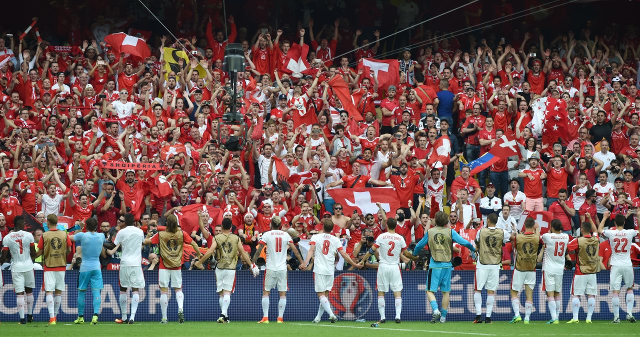 Switzerland's players celebrate their 1-0 victory over Albania with their supporters at the Bollaert-Delelis Stadium in Lens, France, on Saturday, June 11.