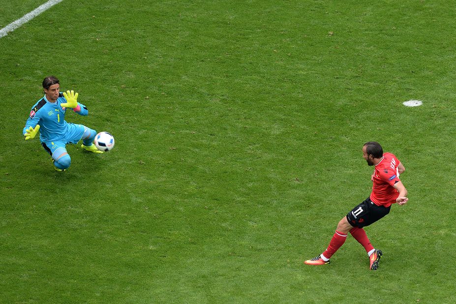 Albania's midfielder Shkelzen Gashi, right, misses a goal opportunity as Switzerland's goalkeeper Yann Sommer stops the ball.