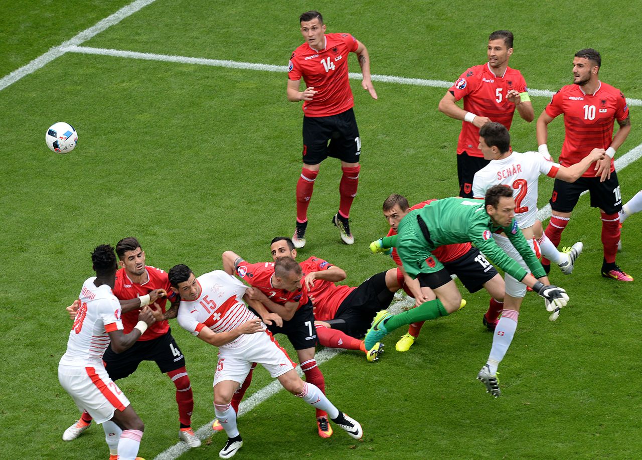 Switzerland's defender Fabian Schaer, second right,  heads the ball to score.
