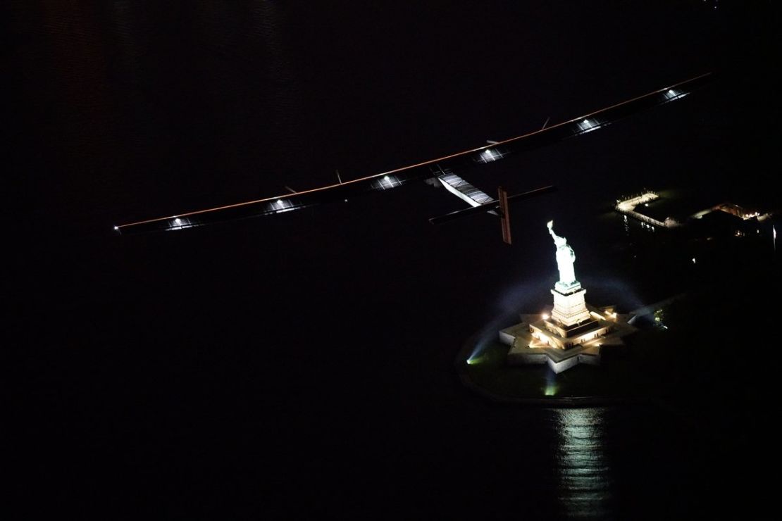 Solar Impulse 2 flies above the Statue of Liberty. 