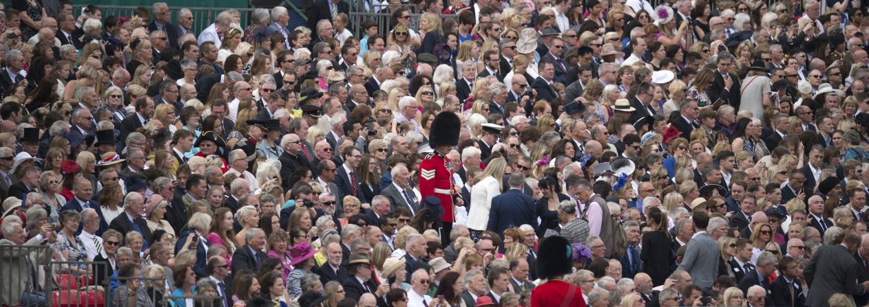 Soldiers direct guests to their seats to watch the traditional <a href="index.php?page=&url=http%3A%2F%2Fedition.cnn.com%2F2016%2F06%2F11%2Feurope%2Fqueen-elizabeth-birthday-britain%2Findex.html">Trooping the Color</a> in London on Saturday, June 11. The Queen continues to celebrate her 90th birthday with the display of more than 1,400 officers and men in their famous red jackets and black bearskin hats, with 200 horses and more than 400 musicians.