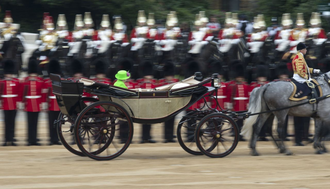 Queen Elizabeth II inspects the soldiers.