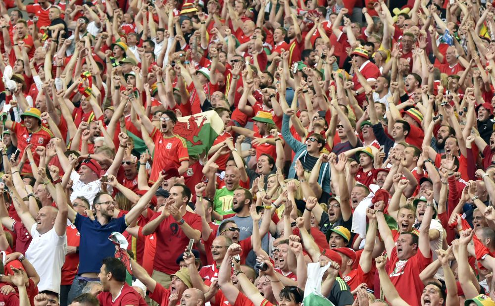 Wales fans celebrate their team's 2-1 win over Slovakia in the Euro 2016 at the Stade de Bordeaux in Bordeaux, France on Saturday,June 11.