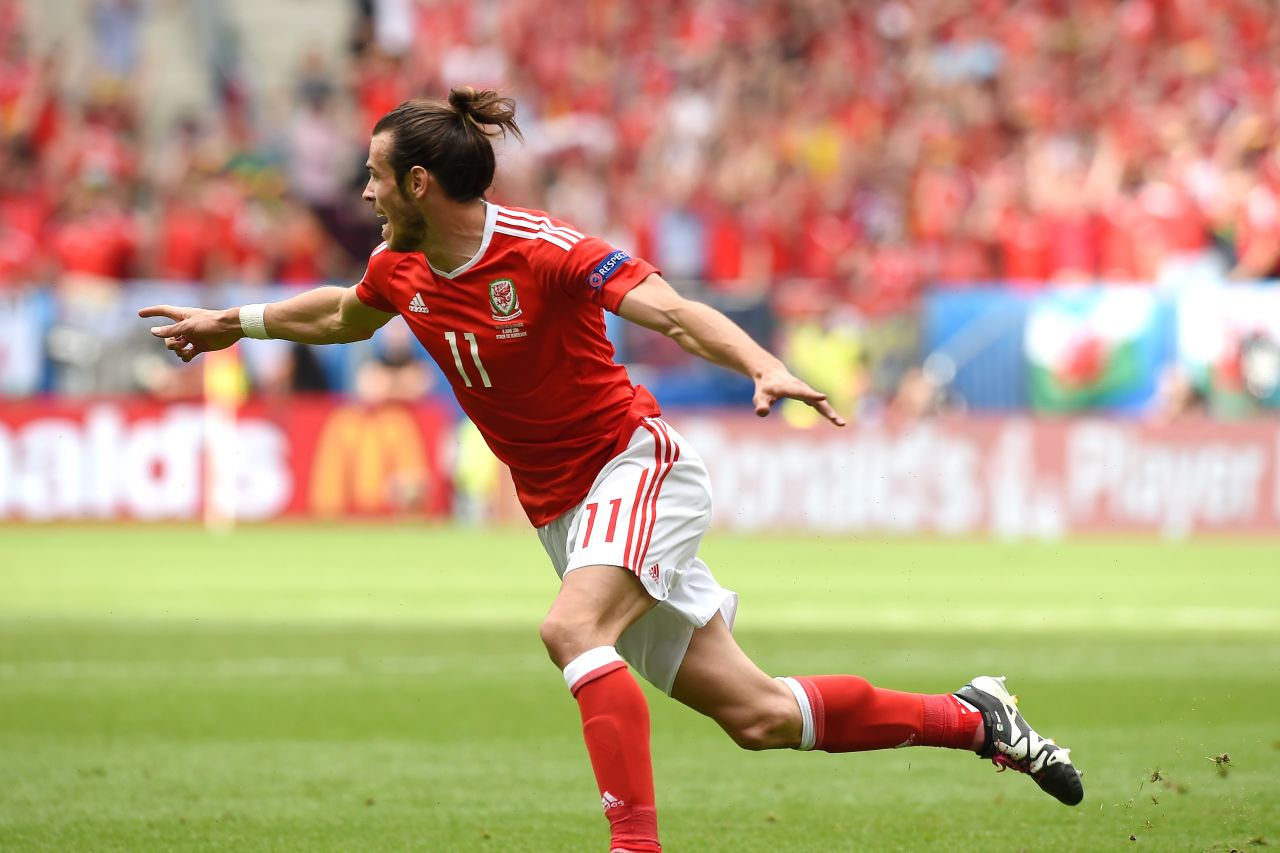Wales forward Gareth Bale celebrates after scoring the match's first goal.