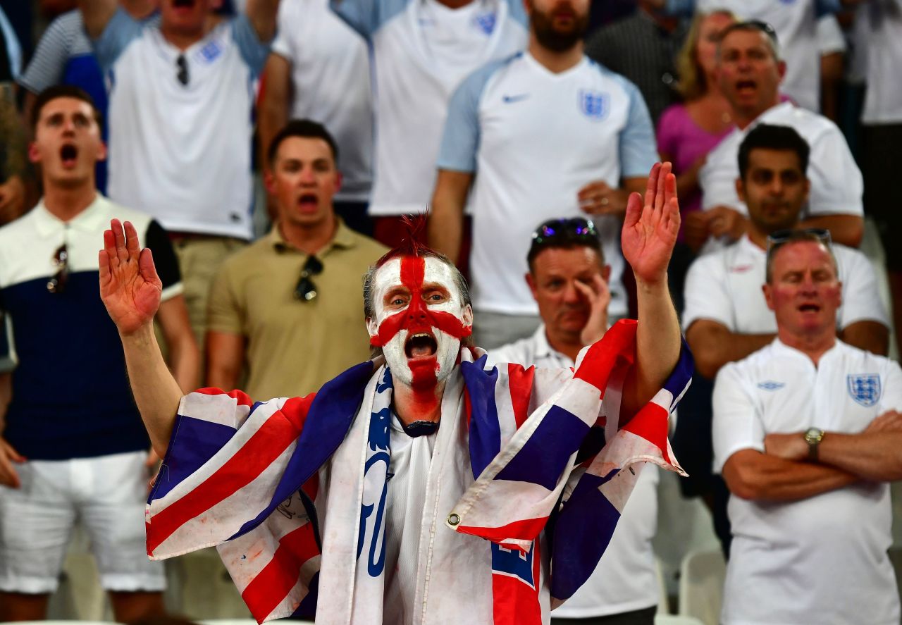 An England supporter cheers on his team. 