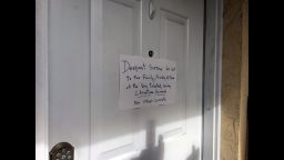 A handwritten note is posted on Kevin James Loibl's family home in St. Petersburg, Florida.