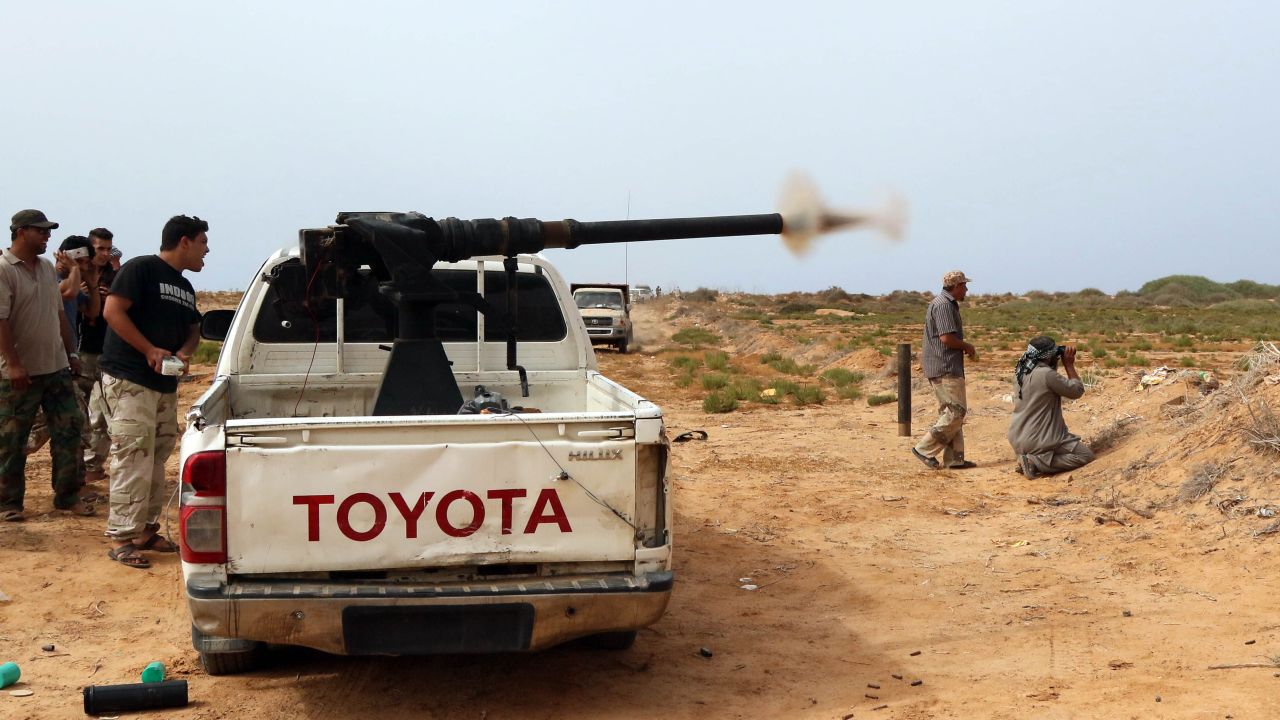 Forces loyal to Libya's UN-backed unity government fire during clashes with jihadists of the Islamic State (IS) group at the western entrance of Sirte on June 2, 2016.
According to Libyan officials fighting resumed on June 1 on the outskirts of Sirte between their forces and jihadist during which three pro-government troops had been killed and 10 more wounded. Sirte was the hometown of slain dictator Moamer Kadhafi and, since seizing it in June last year, IS has turned it into a recruitment and training camp / AFP / MAHMUD TURKIA        (Photo credit should read MAHMUD TURKIA/AFP/Getty Images)