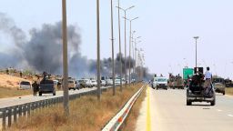 Smoke billows at the entrance of Sirte as forces loyal to Libya's UN-backed unity government advance to recapture the city from the Islamic State (IS) group jihadists on June 10, 2016.
Forces loyal to Libya's unity government fought streets battles with the Islamic State group as they pressed an offensive to recapture their coastal bastion. The loss of Sirte, the hometown of ousted dictator Moamer Kadhafi, would be a major blow to the jihadists at a time when they are under mounting pressure in Syria and Iraq. / AFP / MAHMUD TURKIA        (Photo credit should read MAHMUD TURKIA/AFP/Getty Images)