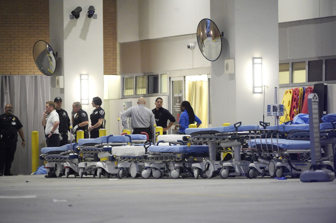 Medical personnel wait with stretchers at the Orlando Regional Medical Center.